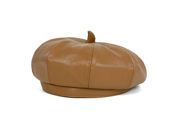 How should a beret be worn to prevent it from falling off?